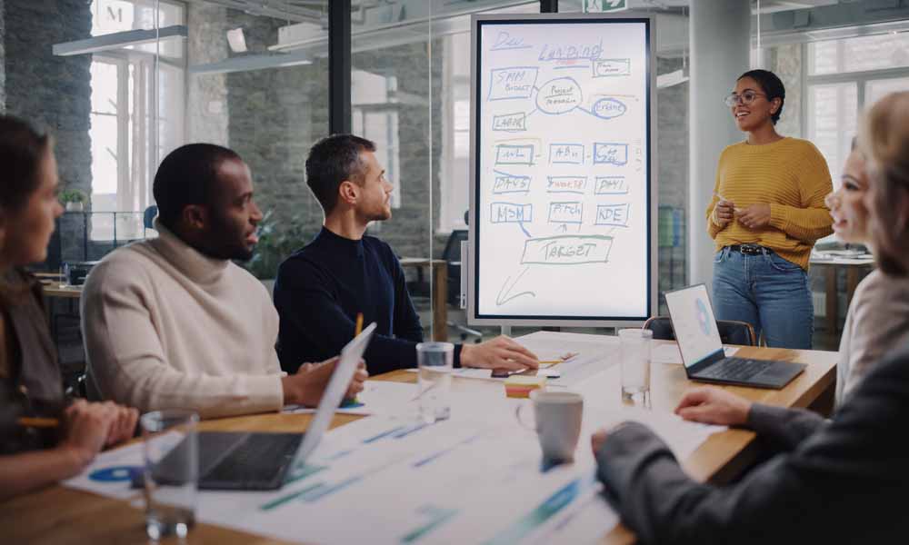 Project Manager Makes a Presentation for a Young Diverse Creativ